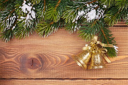 Christmas fir tree with snow and holiday decor on rustic wooden board with copy space Stock Photo - Budget Royalty-Free & Subscription, Code: 400-07773251