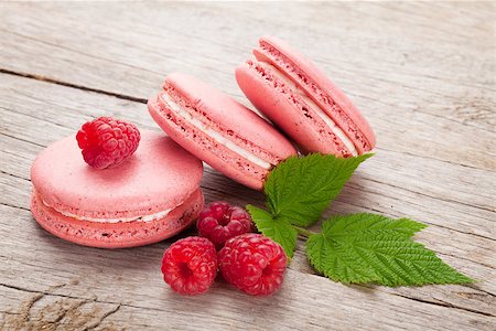 simsearch:400-06564979,k - Pink raspberry macaron cookies on wooden table background Stock Photo - Budget Royalty-Free & Subscription, Code: 400-07773268