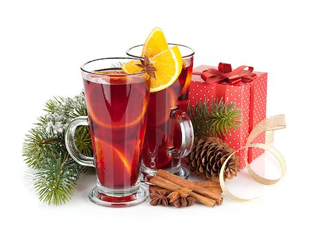 Christmas mulled wine with spices, gift box and snowy fir tree. Isolated on white background Stock Photo - Budget Royalty-Free & Subscription, Code: 400-07773274