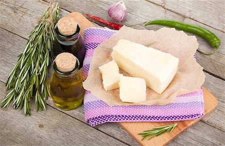 simsearch:400-06919923,k - Parmesan cheese, herbs and spices on wooden table background Stockbilder - Microstock & Abonnement, Bildnummer: 400-07773293