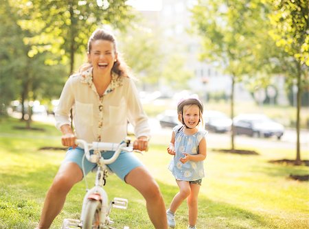 funny bikers pictures - Mother and baby girl having fun with bicycle in park Stock Photo - Budget Royalty-Free & Subscription, Code: 400-07794031