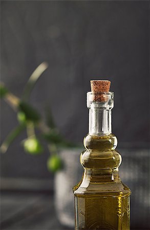 simsearch:400-05666507,k - Extra virgin healthy Olive oil with fresh olives on dark wooden background Stock Photo - Budget Royalty-Free & Subscription, Code: 400-07794256