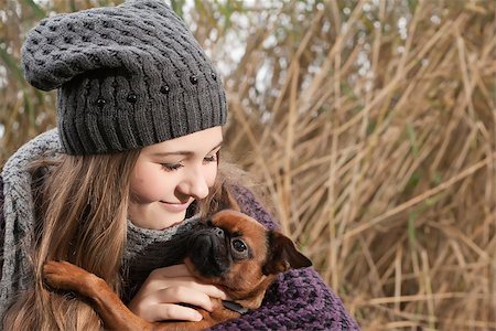 puppy in the park - Young teenage girl is having a nice time in the cold november Stock Photo - Budget Royalty-Free & Subscription, Code: 400-07794298