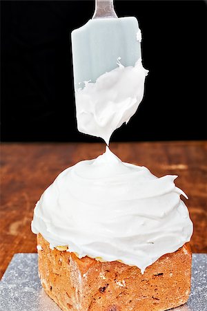 Spreading cream on christmas cake icing with spatula Stock Photo - Budget Royalty-Free & Subscription, Code: 400-07794473