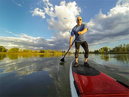 simsearch:400-07795226,k - senior male paddler enjoying workout on stand up paddleboard (SUP), calm lake in Colorado, summer Foto de stock - Royalty-Free Super Valor e Assinatura, Número: 400-07794663