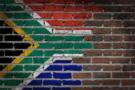 simsearch:400-05891783,k - Dark brick wall texture - flag painted on wall - South Africa Photographie de stock - Aubaine LD & Abonnement, Code: 400-07794682