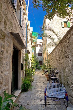 Narrow mediterranean stone street in Stari Grad, Island of Hvar, Croatia Stock Photo - Budget Royalty-Free & Subscription, Code: 400-07795591