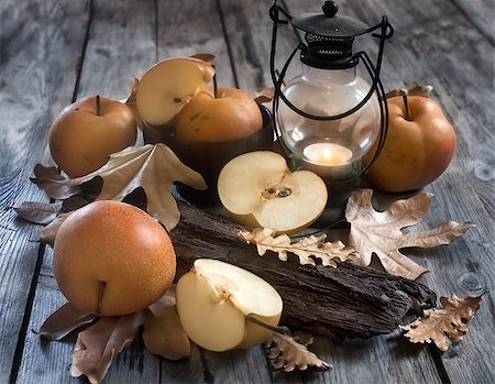 simsearch:400-05381568,k - Ripe asian pears, lantern with candle and fall leaves on wooden table. Autumn concept. Selective focus. Stock Photo - Budget Royalty-Free & Subscription, Code: 400-07795850