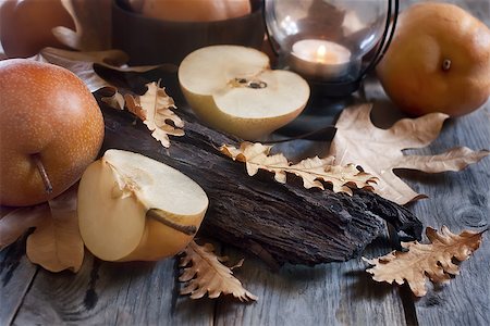 simsearch:400-05381568,k - Ripe asian pears, lantern with candle and fall leaves on wooden table. Autumn concept. Selective focus. Stock Photo - Budget Royalty-Free & Subscription, Code: 400-07795851