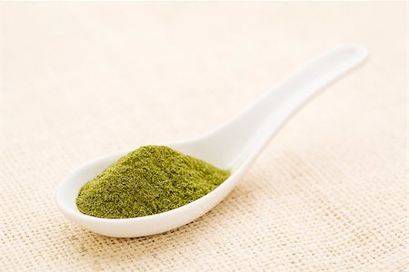 simsearch:400-08339036,k - organic wheatgrass powder on a white Chinese spoon against burlap canvas Stock Photo - Budget Royalty-Free & Subscription, Code: 400-07795896