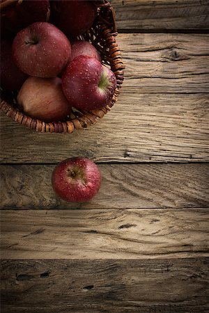simsearch:825-03626863,k - Fresh harvest of apples. Nature theme with red grapes and basket on wooden background. Nature fruit concept. Stock Photo - Budget Royalty-Free & Subscription, Code: 400-07796048
