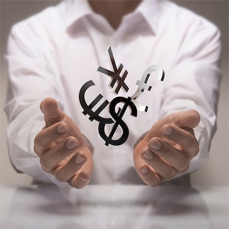 pound and dollar sign - Man hands holding currencies symbols. currency exchange service concept. Stock Photo - Budget Royalty-Free & Subscription, Code: 400-07796387