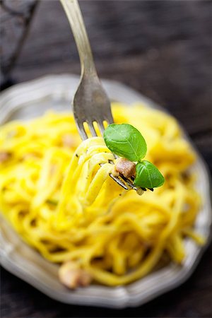 simsearch:400-07465860,k - Italian cooking. Pasta spaghetti carbonara with ham, eggs and basil Stock Photo - Budget Royalty-Free & Subscription, Code: 400-07796579