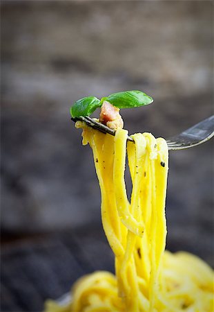 simsearch:400-08964146,k - Italian cooking. Pasta spaghetti carbonara with ham, eggs and basil Stock Photo - Budget Royalty-Free & Subscription, Code: 400-07796580