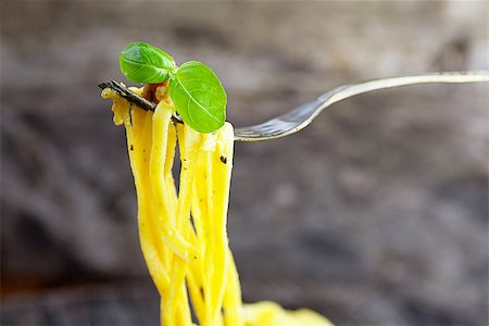 simsearch:400-08964146,k - Italian cooking. Pasta spaghetti carbonara with ham, eggs and basil Stock Photo - Budget Royalty-Free & Subscription, Code: 400-07796582