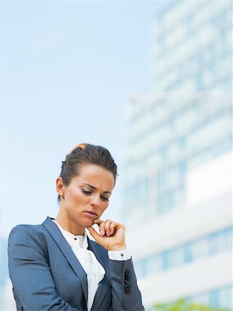 depressed woman in the street - Portrait of stressed business woman in office district Stock Photo - Budget Royalty-Free & Subscription, Code: 400-07796712