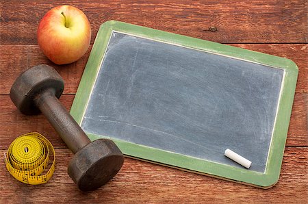 blank slate blackboard sign against weathered red painted barn wood with a dumbbell, apple and tape measure, ready for text related to fitness, diet or weight loss Stock Photo - Budget Royalty-Free & Subscription, Code: 400-07796978