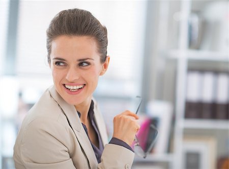 diretor de escola - Happy business woman with eyeglasses in office Foto de stock - Royalty-Free Super Valor e Assinatura, Número: 400-07797091