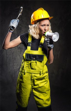 simsearch:400-07716868,k - Attractive builder woman shouting through megaphone Stock Photo - Budget Royalty-Free & Subscription, Code: 400-07791662