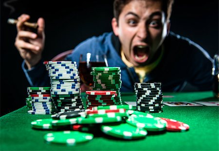 simsearch:400-06136085,k - Poker player Fotografie stock - Microstock e Abbonamento, Codice: 400-07791707