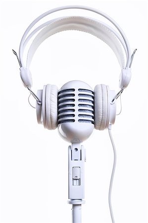 White vintage microphone and headphones over white background Stock Photo - Budget Royalty-Free & Subscription, Code: 400-07792005