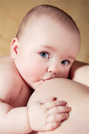 drinking milk with mom - Mother breast feeding her infant Stock Photo - Budget Royalty-Free & Subscription, Code: 400-07792025