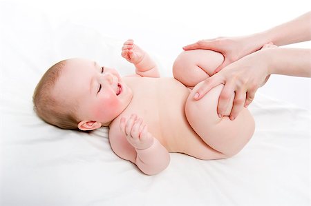 female foot massage - Mother massaging her baby girl Photographie de stock - Aubaine LD & Abonnement, Code: 400-07792040