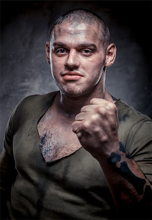 Portrait of young fighter with dirty face and chest Stock Photo - Budget Royalty-Free & Subscription, Code: 400-07792055