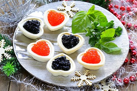 simsearch:400-07572419,k - Festive Christmas appetizer tartlets with red and black caviar Stock Photo - Budget Royalty-Free & Subscription, Code: 400-07792785