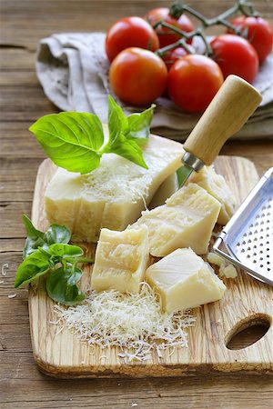 fresh tasty hard parmesan cheese on a wooden board Stock Photo - Budget Royalty-Free & Subscription, Code: 400-07792781