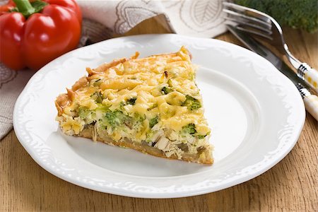 Quiche pie with broccoli, chicken and ham on white plate Fotografie stock - Microstock e Abbonamento, Codice: 400-07792897
