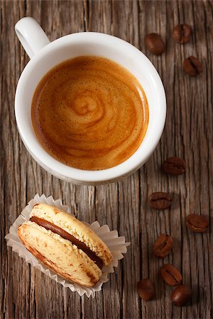 pictures of coffee beans and berry - Cup of coffee with chocolate macaron on wooden background with copy space for text. Stock Photo - Budget Royalty-Free & Subscription, Code: 400-07792965