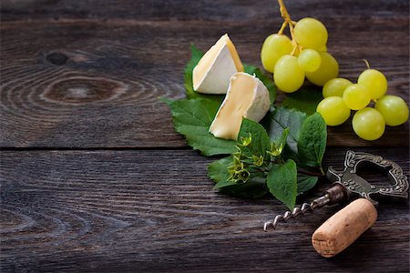 simsearch:400-04040057,k - Delicious cheese and ripe grape with wine cork and corkscrew on an old wooden board. Vintage style. Stock Photo - Budget Royalty-Free & Subscription, Code: 400-07792975