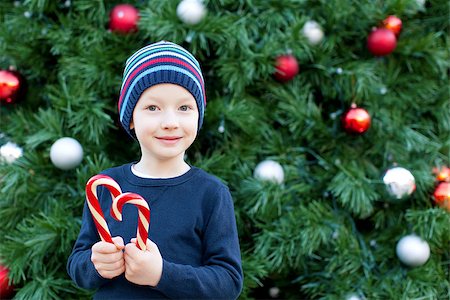 silly winter boy - cute little boy with candy cane at christmas time Stock Photo - Budget Royalty-Free & Subscription, Code: 400-07793422