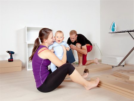 Young Family with a Baby  Moving in a New Apartment Stock Photo - Budget Royalty-Free & Subscription, Code: 400-07793448