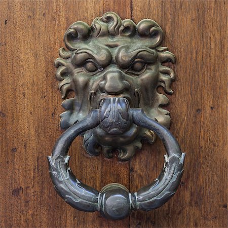 perseomedusa (artist) - Italy. Ancient knocker on old wood door. Fotografie stock - Microstock e Abbonamento, Codice: 400-07793498