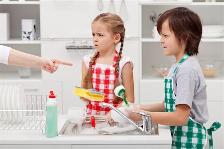 pictures of kids helping parents with dishes - Grumpy kids ordered to do the dishes - by a parent pointed finger Stock Photo - Budget Royalty-Free & Subscription, Code: 400-07793746