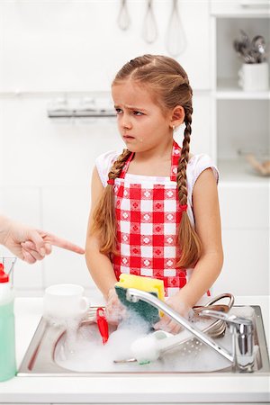 pictures of kids helping parents with dishes - Sulking little girl doing the dishes on parents order Stock Photo - Budget Royalty-Free & Subscription, Code: 400-07793747
