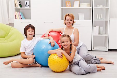 Woman and kids ready for gymnastic - sitting on the floor with large exercise balls Stock Photo - Budget Royalty-Free & Subscription, Code: 400-07793740