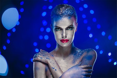 Beautiful woman with creative bright make-up over glowing lights Photographie de stock - Aubaine LD & Abonnement, Code: 400-07793897