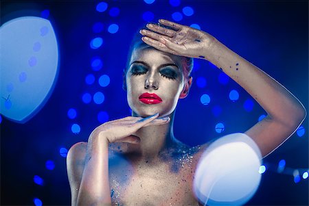 red lipstick art - Beautiful woman with creative bright make-up over glowing lights Stock Photo - Budget Royalty-Free & Subscription, Code: 400-07793898