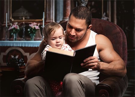 Father reading book to daughter Stock Photo - Budget Royalty-Free & Subscription, Code: 400-07793891