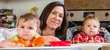 A mother in the kitchen poses with babies Stock Photo - Budget Royalty-Free & Subscription, Code: 400-07816963