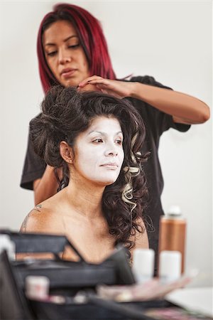 Native American makeup artist working beautiful female performer Fotografie stock - Microstock e Abbonamento, Codice: 400-07816975