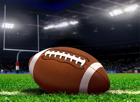 Football Ball on Grass in Stadium Stock Photo - Budget Royalty-Free & Subscription, Code: 400-07817256