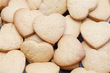 Freshly baked cookies in heart shapes lying in a heap Stock Photo - Budget Royalty-Free & Subscription, Code: 400-07817327