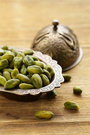 simsearch:400-09080000,k - peeled green pistachio nuts on a wooden background Stock Photo - Budget Royalty-Free & Subscription, Code: 400-07817411