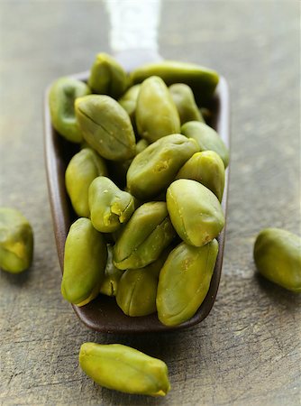 simsearch:400-09080000,k - peeled green pistachio nuts on a wooden background Stock Photo - Budget Royalty-Free & Subscription, Code: 400-07817413