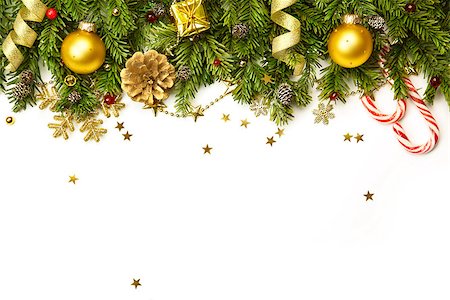 Christmas tree branches with golden baubles, stars, snowflakes isolated on white  -  horizontal border Stock Photo - Budget Royalty-Free & Subscription, Code: 400-07817633