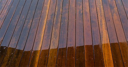sherjaca (artist) - Timber floorboards on outside deck wet from rain water for background Fotografie stock - Microstock e Abbonamento, Codice: 400-07817645